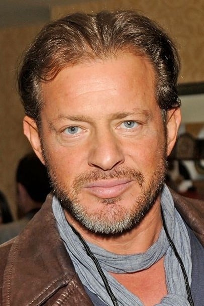 Picture of Costas Mandylor wearing brown jacket